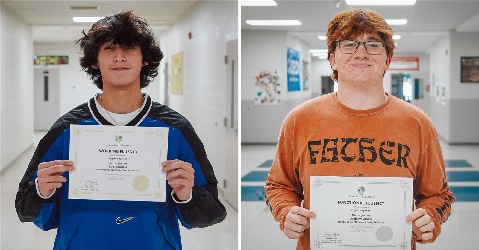 two students in a blue and orange sweatshirt hold a certificate